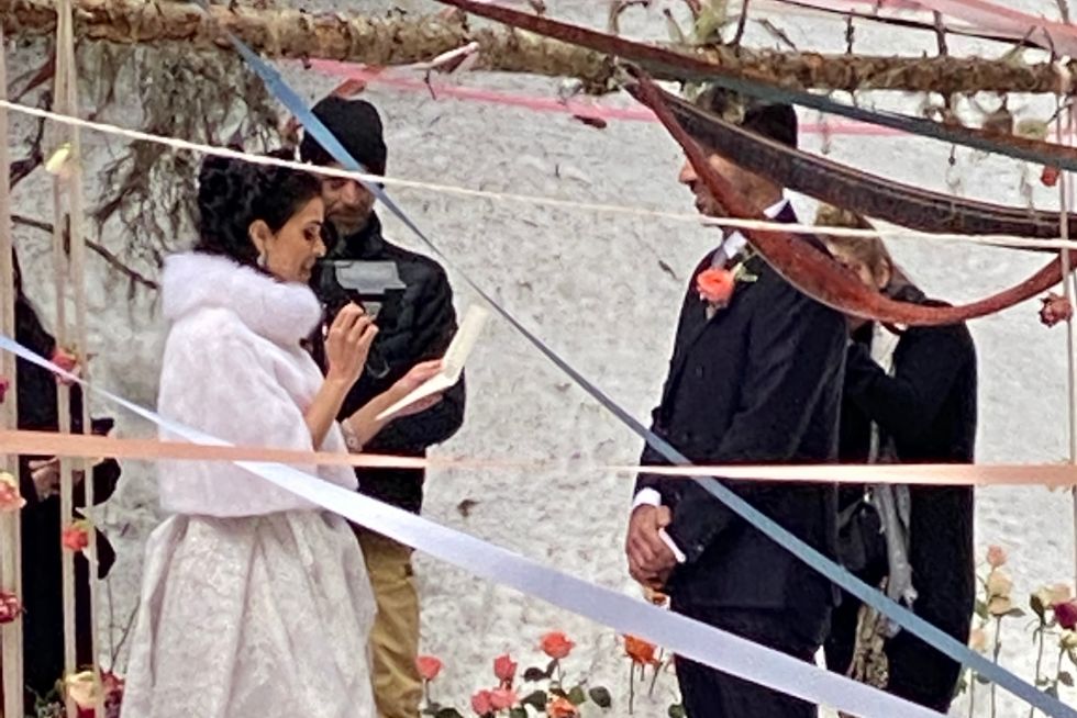 winter wedding in France, the couple reading their vows