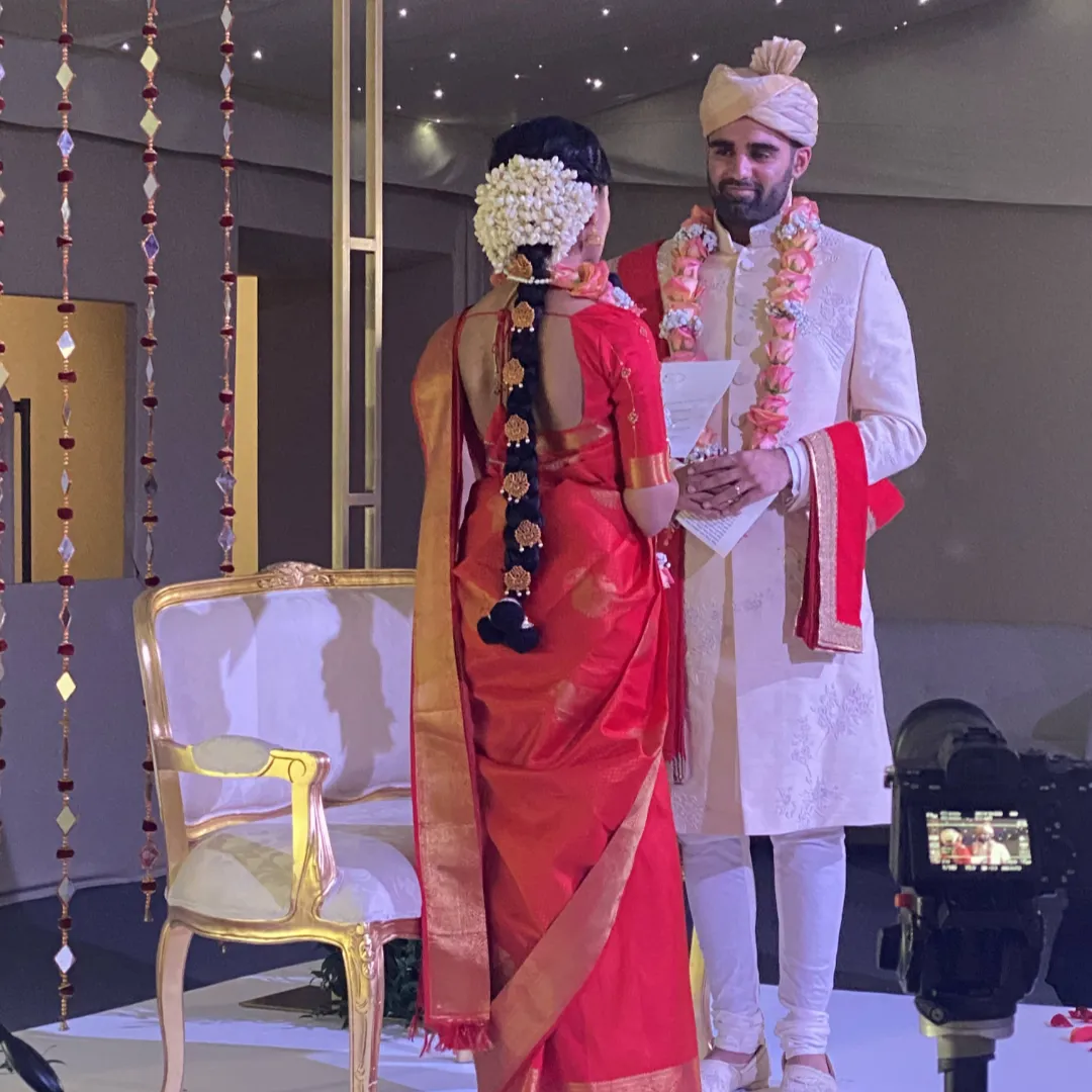 couple saying vows at multicultural wedding ceremony