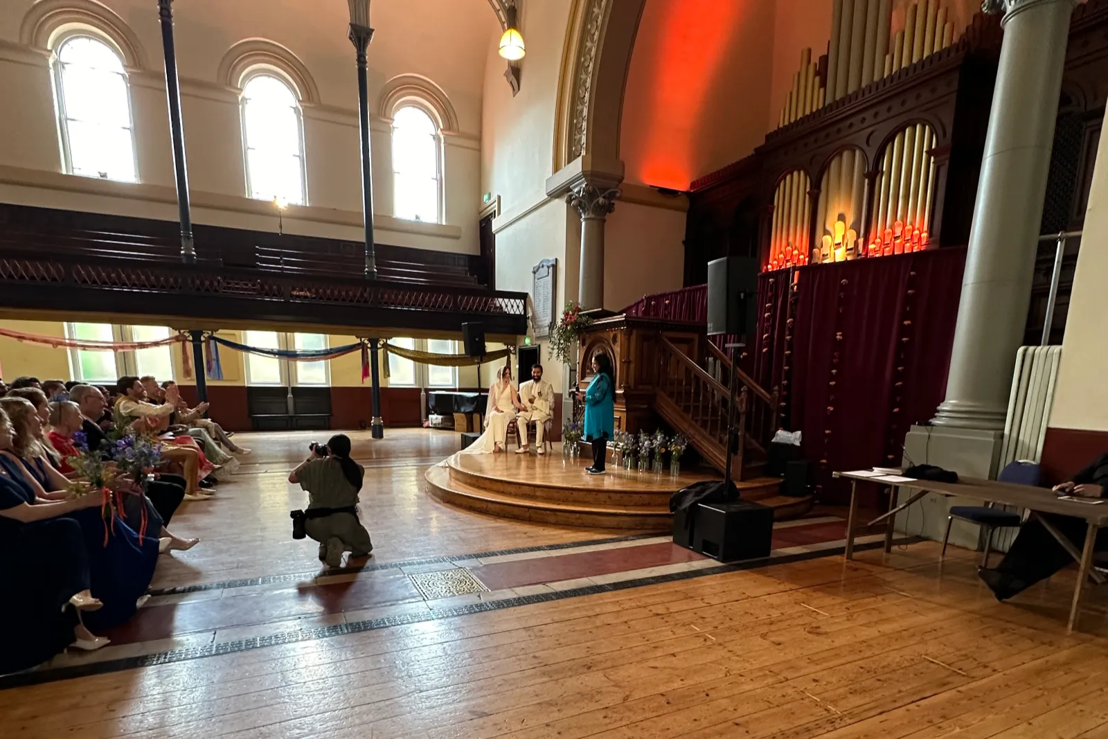 photographer in front of wedding couple at ceremony