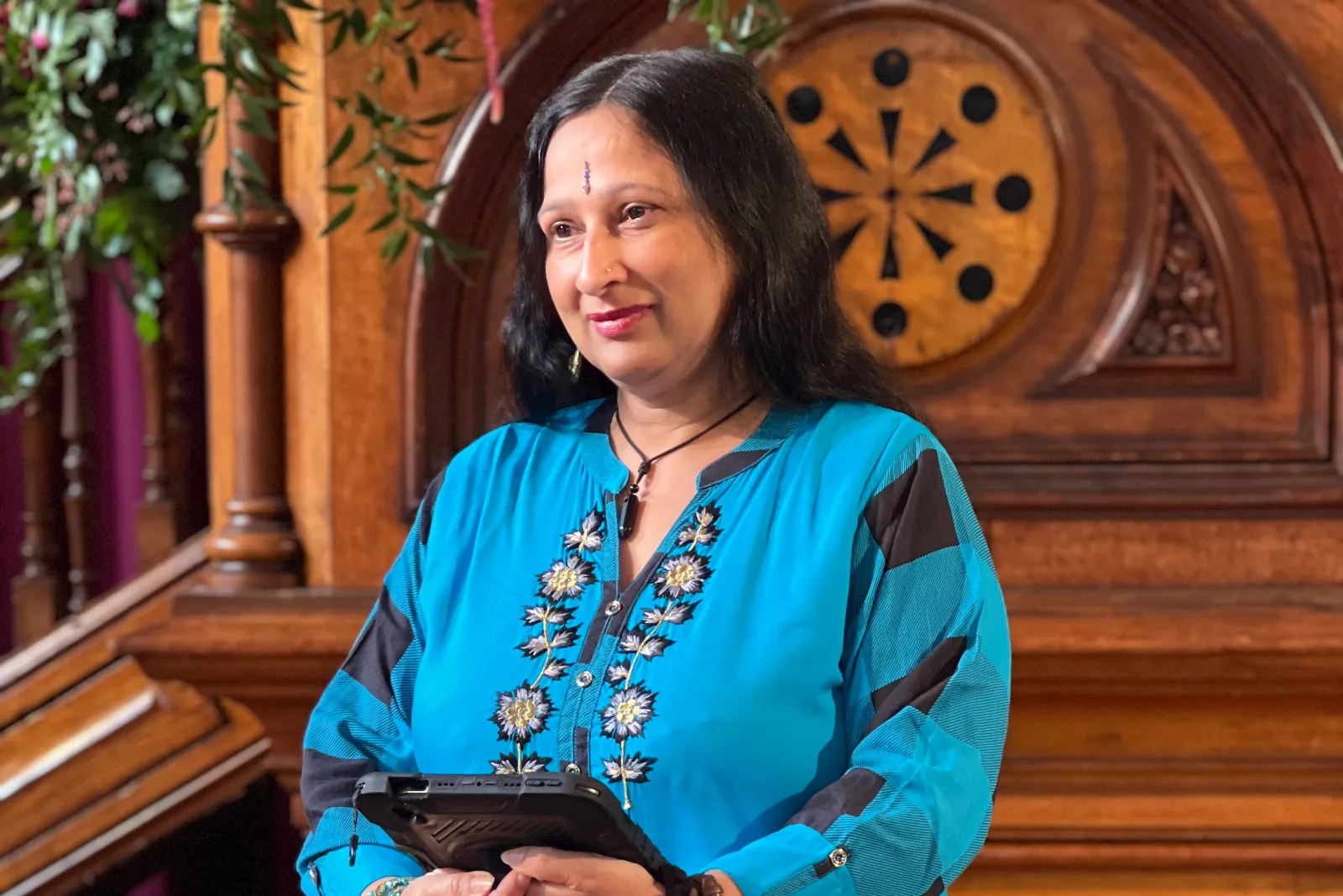 Sonal reading from iPad at wedding ceremony