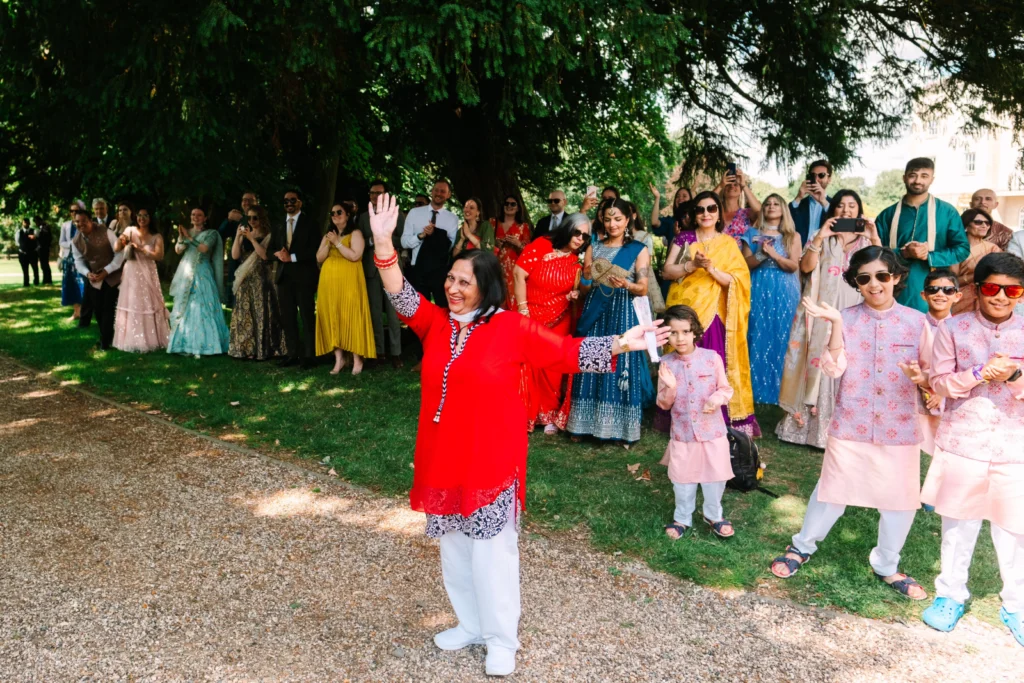 Asian celebrant with wedding guests