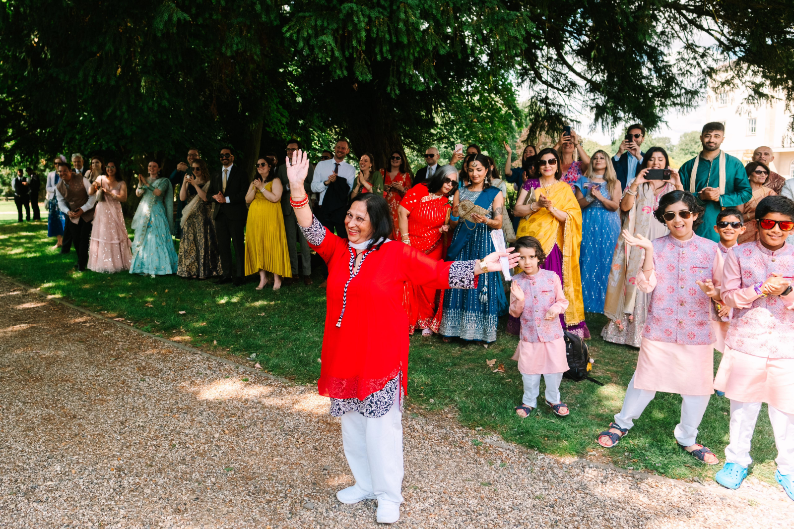 Asian celebrant with wedding guests