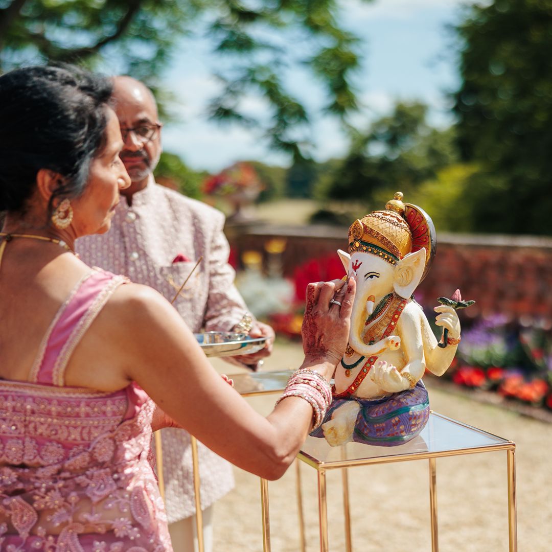 A decorative Ganesh statue is included as part of the cultural elements of Natasha and Aaron’s multicultural wedding ceremony.