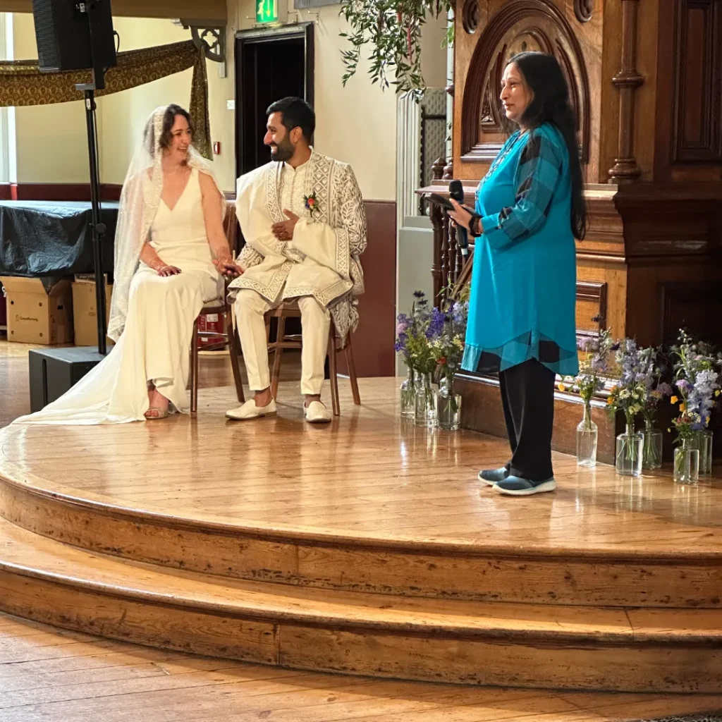 couple smiling at wedding ceremony