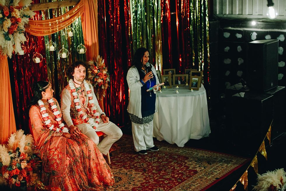 couple and celebrant during multicultural wedding ceremony